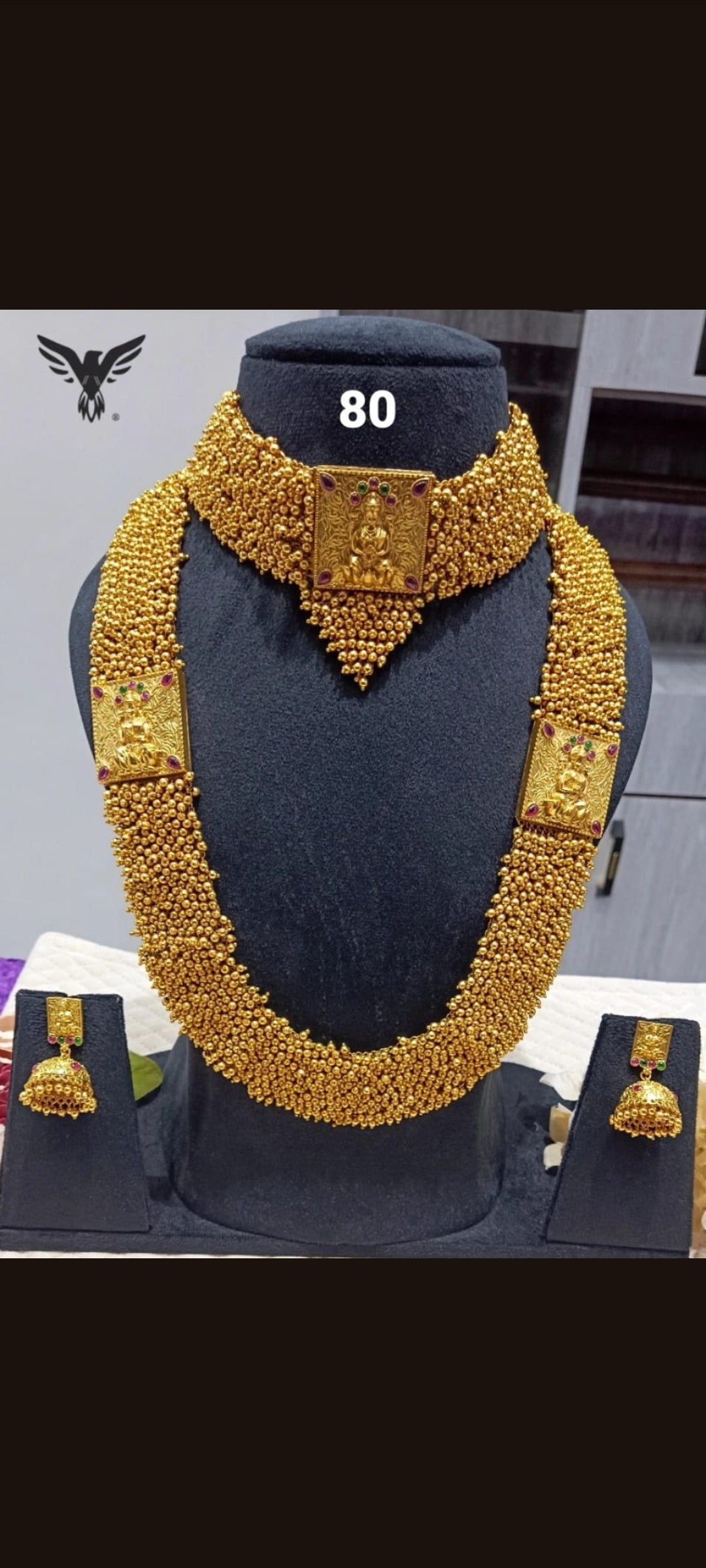 Lakshmi necklace in long short pattern with jhumka earrings in brass matte gold polish, perfect for south indian weddings