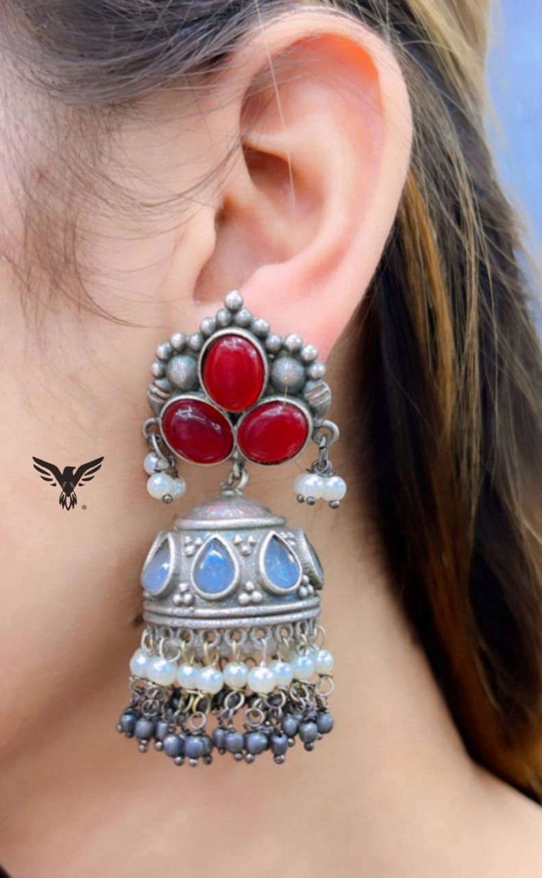 Avneet Silver Look Alike Jhumkis In Red And Blue Stone For Women