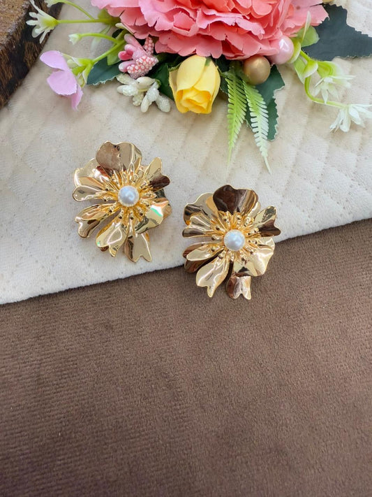 Brass floral studs in golden polish with pearl studded at the centre for girls and women