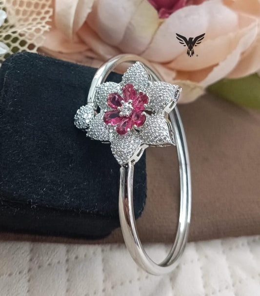 ADJUSTABLE SILVER POLISH WITH PINK CZ STONE